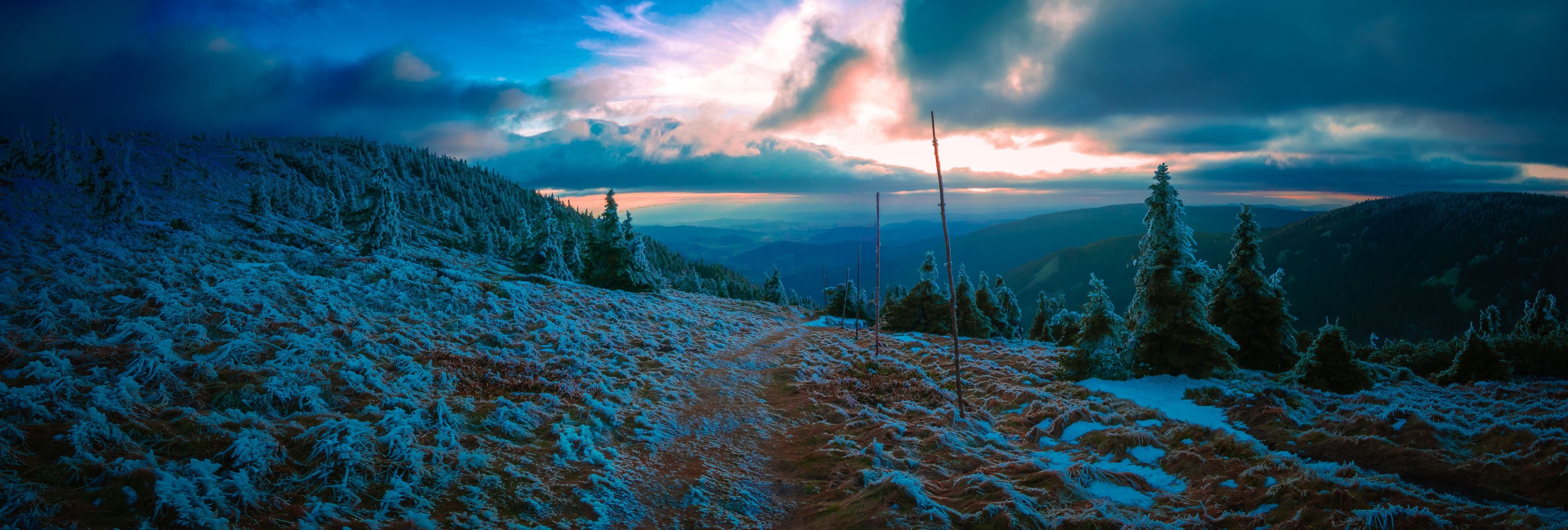 A snow-covered mountain landscape with a clear sky.