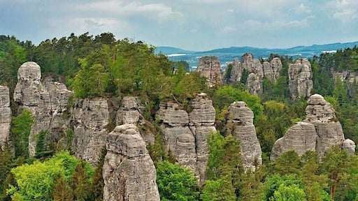 May 2015
Vyhlídka na Kapelu, Hrube rocks, Bohemian Paradise, Czech republic
Bohemian Paradise (=Český Ráj) is a nature reserve protected area established in 1955 and it is located in North Bohemia. It has a varied country side with plenty of first and beech surrounding wonderful sandstone rock formations. The water, wind and frost erosion has left many uniquely shaped rock towers having up to 60 meters of height and these are a popular place for Czech rock climbers for decades.
In the picture is the main part of Hrube rocks in Bohemian Paradise. This panoramic viewpoint is called View of the Orchestra. The Orchestra is the group of the sandstone towers on the left, with one needle standing before them, which is called the Dirigent. On the right in the background is the Lighthouse area with Lighthouse and Gate rocks.