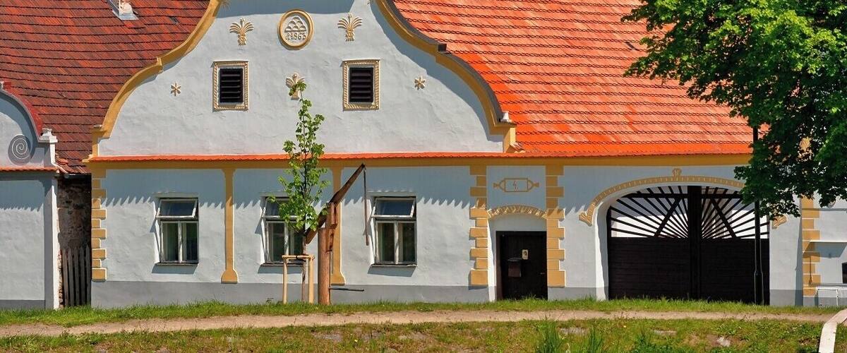 May 2009
Holašovice
Holašovice is a small historic village located in the south of the Czech Republic, 15 kilometres west of České Budějovice. The village was deserted after the Second World War, allowing its medieval plan and vernacular buildings in the South Bohemian Folk or Rural Baroque style to remain intact. It was restored and repopulated from 1990, and it was designated as a UNESCO World Heritage Site in 1998.
Holašovice is a typical Bohemian village for the Hlubocká Blatská area around České Budějovice. It consists of 23 brick farmyards containing 120 buildings, each with their gable end facing a central broad village green, with a fish pond and chapel.
The buildings date from the 18th to 20th century, with most of them built in the second half of the 19th century. They are constructed in the South Bohemian Folk Baroque style.
#UNESCO