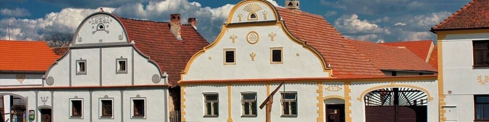 April 2009
Holašovice
Holašovice is a small historic village located in the south of the Czech Republic, 15 kilometres west of České Budějovice. The village was deserted after the Second World War, allowing its medieval plan and vernacular buildings in the South Bohemian Folk or Rural Baroque style to remain intact. It was restored and repopulated from 1990, and it was designated as a UNESCO World Heritage Site in 1998.
Holašovice is a typical Bohemian village for the Hlubocká Blatská area around České Budějovice. It consists of 23 brick farmyards containing 120 buildings, each with their gable end facing a central broad village green, with a fish pond and chapel.
The buildings date from the 18th to 20th century, with most of them built in the second half of the 19th century. They are constructed in the South Bohemian Folk Baroque style.
#UNESCO