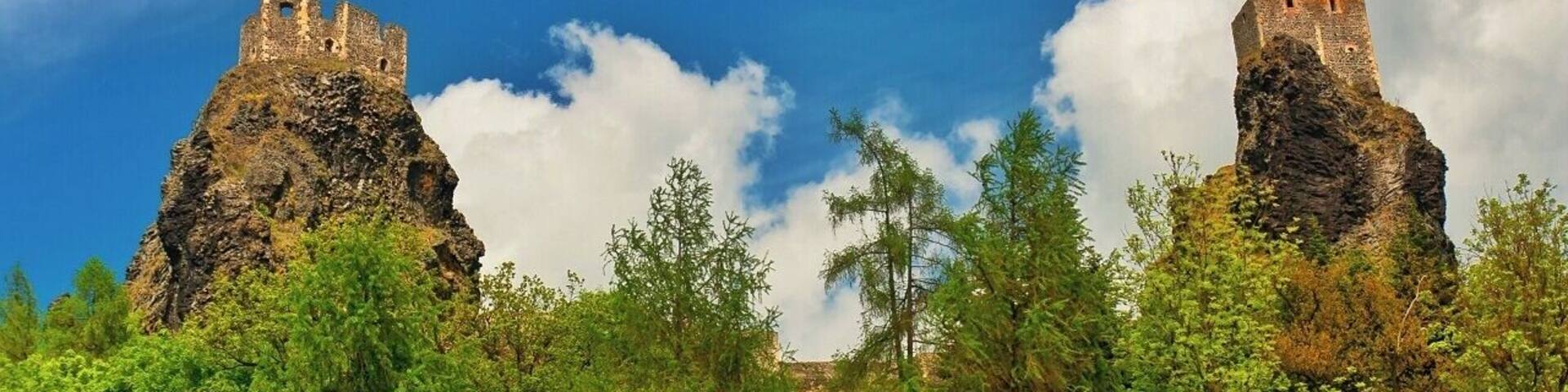 May 2015
Castle Trosky, Český ráj, Czech republic
Trosky is a castle ruin located some 75 km north from Prague in a natural reservation region called Český ráj (=Bohemian paradise) making a landmark of it. It is one of the most famous Czech castles and is situated on the summits of two basalt volcanic plugs. On the lower peak (47 m) is the two-storey structure called Baba (Old Woman), and on the higher outcrop (57 m) is the four-sided structure known as Panna (Virgin).
It was built in 1380 and was used for a century. It is a ruin since 1648 when it was burned down during the Thirty years war. Since 1928 a propery of the Club of Czech tourists and a popular tourist spot.
View from below, Virgin tower is on the left and Old Woman tower is on the right.