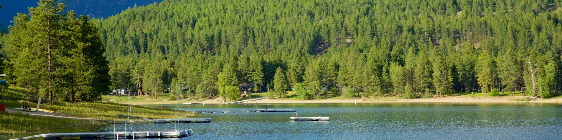Skookumchuck which includes a lake or waterhole, mountains and tranquil scenes