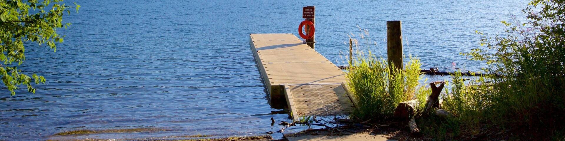 Central Washington which includes mountains, forest scenes and a lake or waterhole