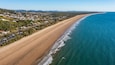 Yeppoon Beach showing landscape views, a coastal town and a beach