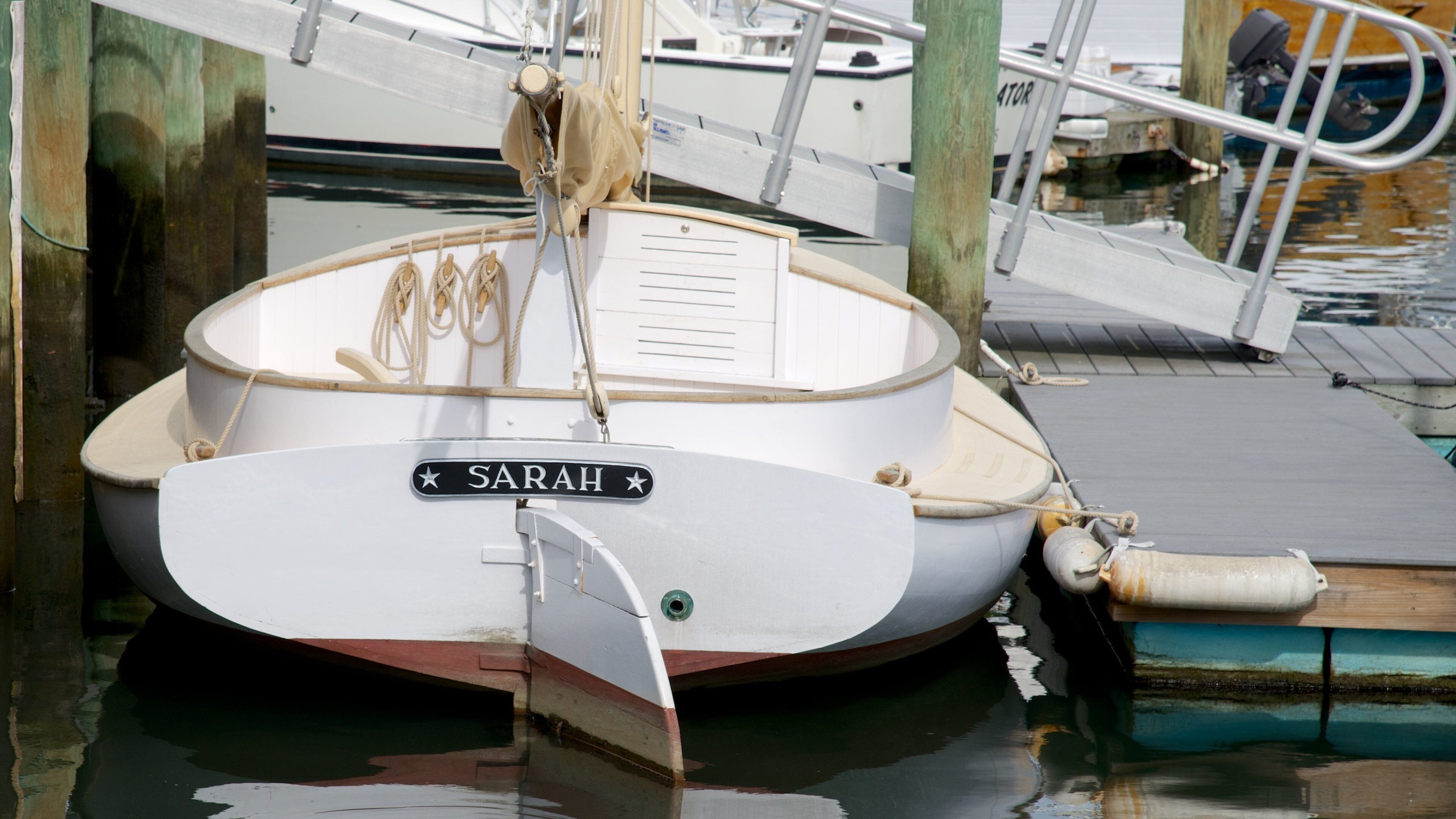 Cape Cod Maritime Museum which includes a bay or harbor and signage