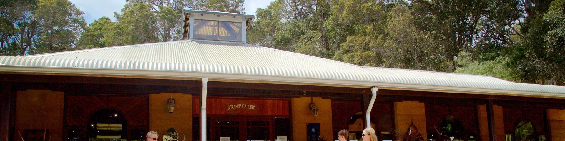 A gallery with a corrugated metal roof, steps leading up to it, and a sign reading "BORANUP GALLERY".