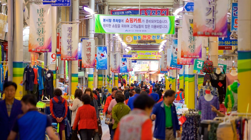 Busan which includes signage, interior views and markets