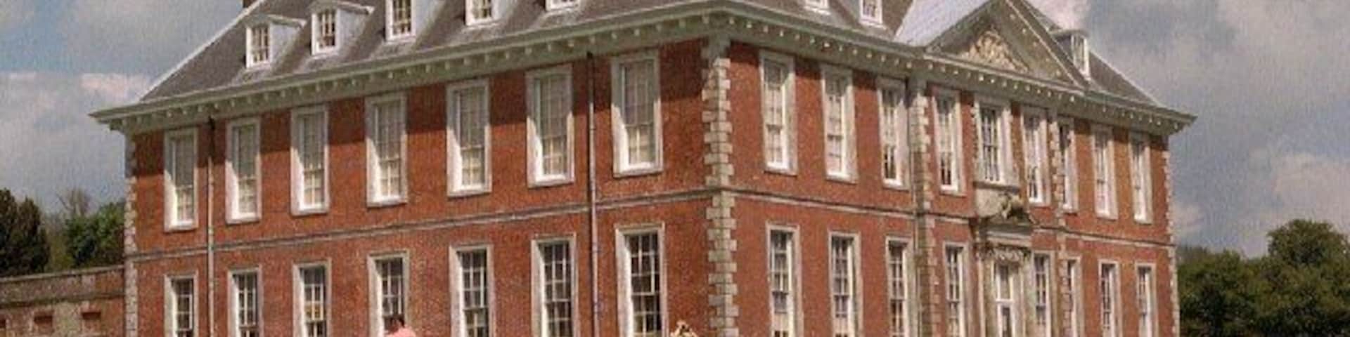 Uppark. Built 1690, with a fine view from the South Downs to the sea. HG Wells' mother was housekeeper here. It was severely damaged by fire in 1989 and only reopened in 1995 after extensive repairs. This is the main house: I think the geograph 18782 is of the former stable block