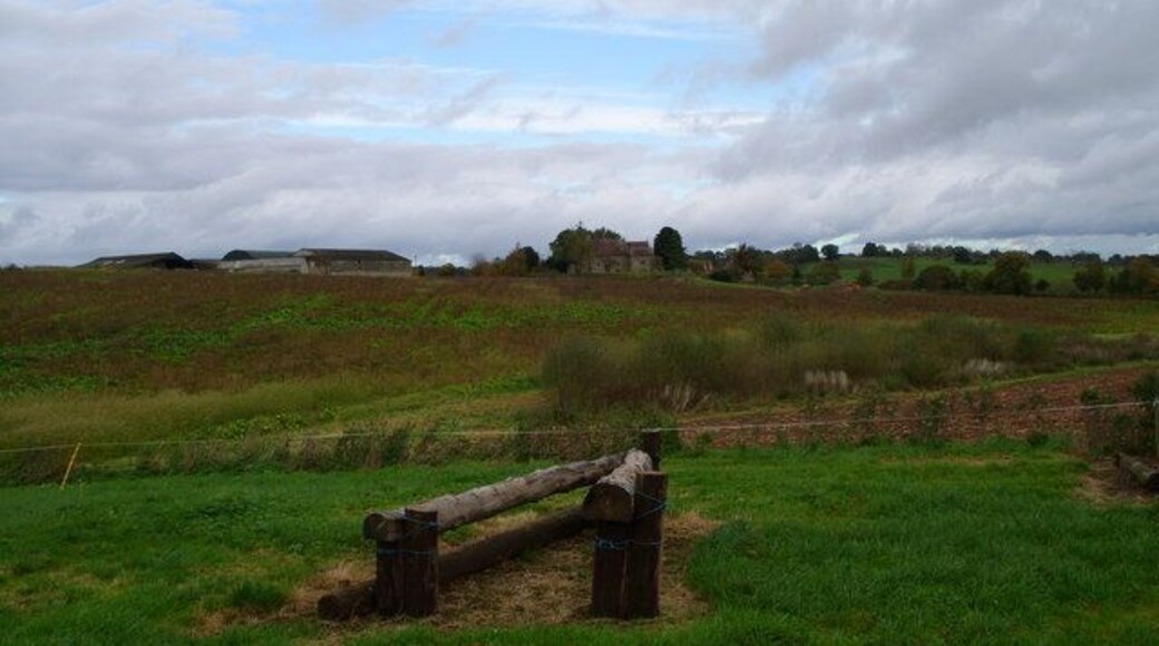 Cross Country Jump with Pauntley Church and Pauntley Court in the distance Nice clouds?