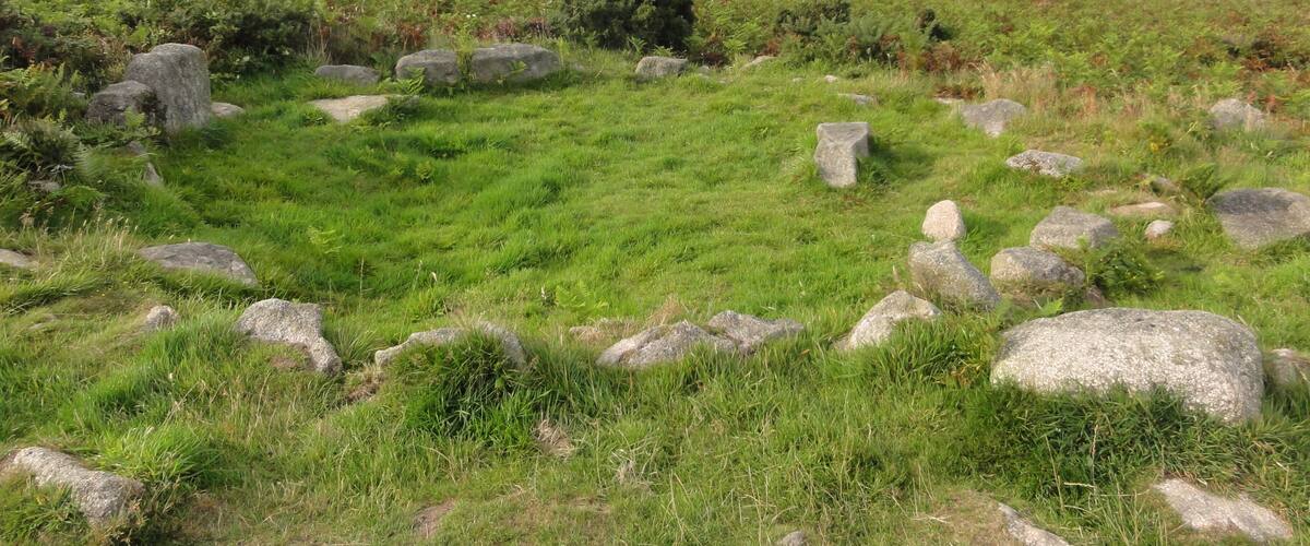 Photographs taken in Cornwall. Ancient hut circle on top of the carn.