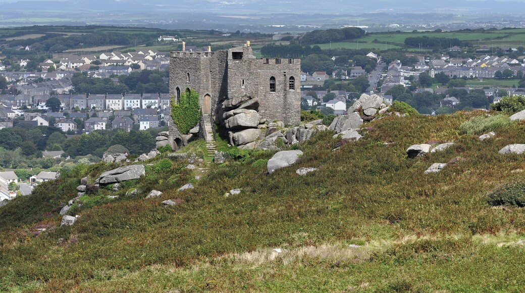 Carn Brea Castle in Cornwall, overlooking Redruth. It was built as a folly, and is now a restaurant. The high ground near Hensbarrow is visible in the distance.
