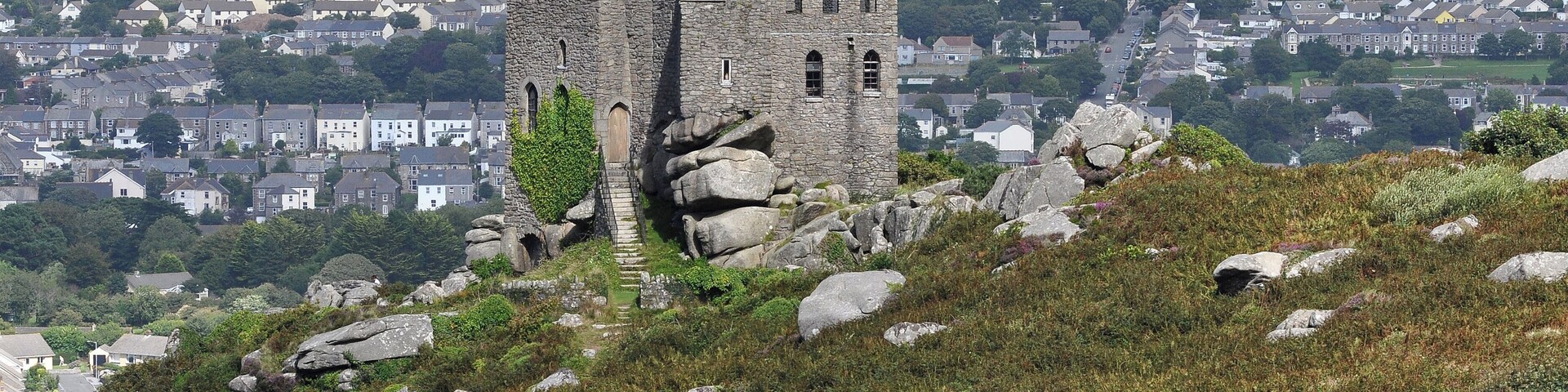 Carn Brea Castle in Cornwall, overlooking Redruth. It was built as a folly, and is now a restaurant. The high ground near Hensbarrow is visible in the distance.