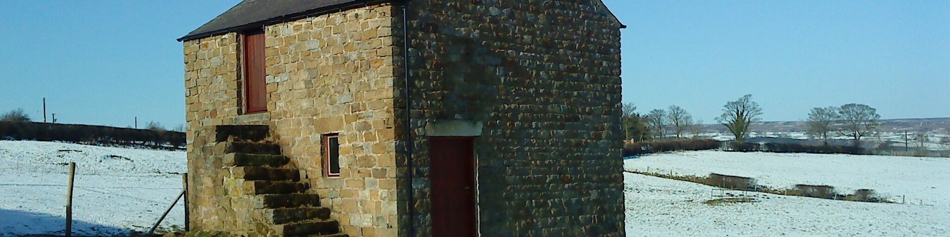 Barn on Hogerston Hill Tidy barn on a snowy hillside near Dallowgill.