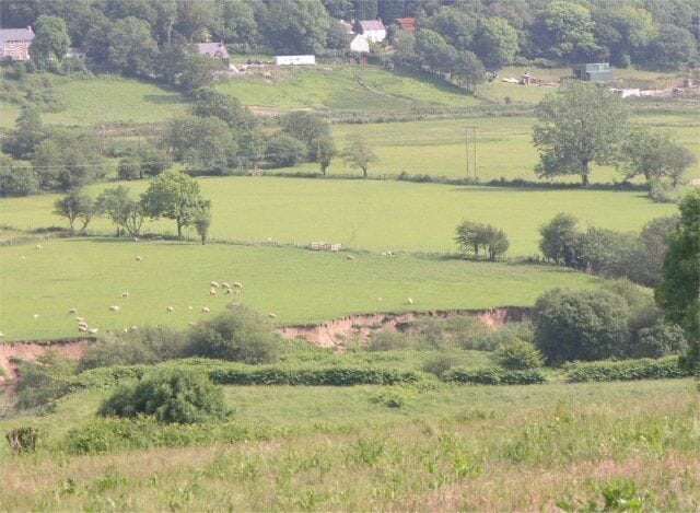 Flood plain erosion The river is just out of sight in this picture, but recent river erosion into the flood plain is clearly visible by the Loughor river.