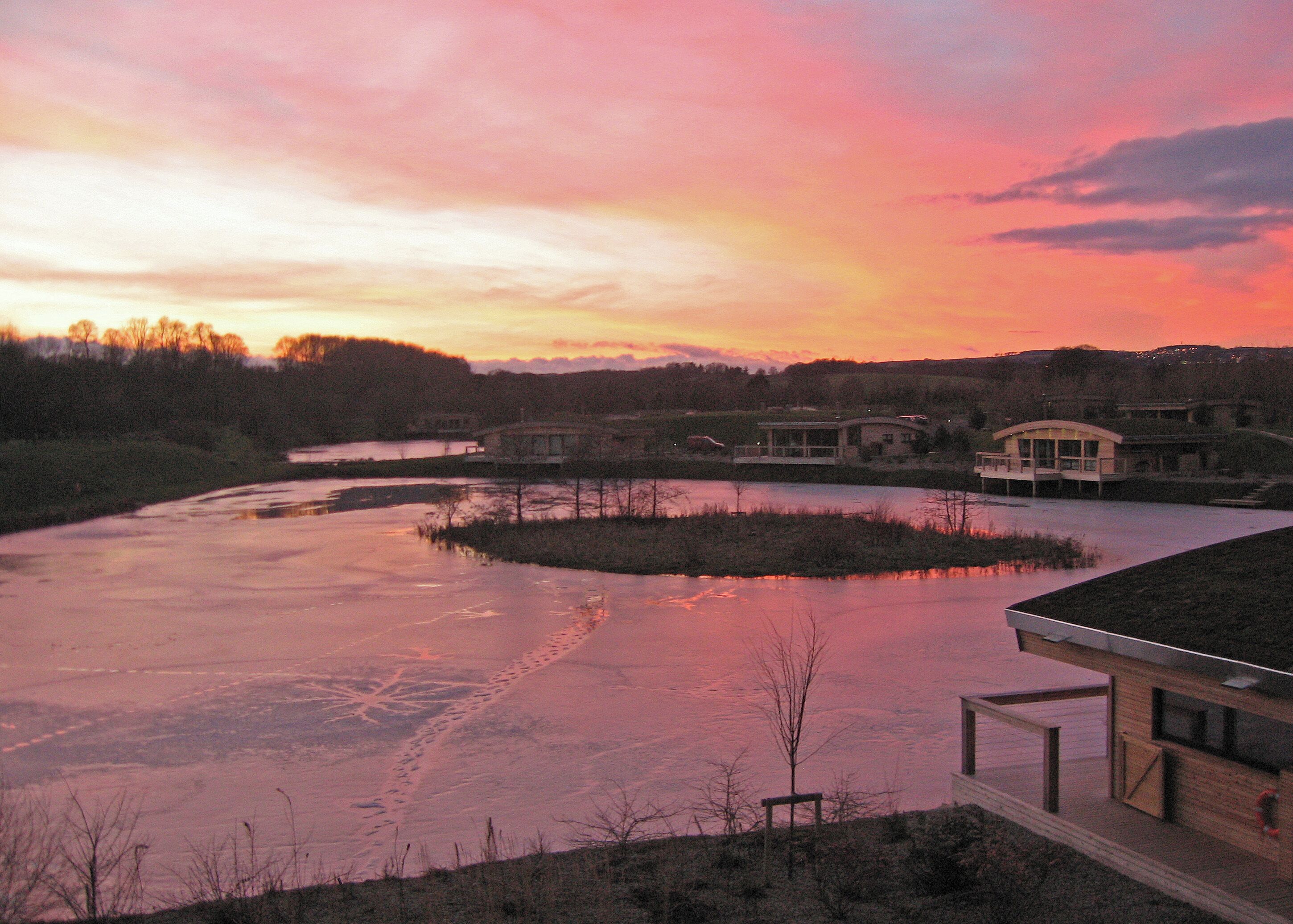 Sunset, Brompton Lakes Frozen lake with Eco Lodges.