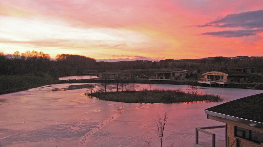 Sunset, Brompton Lakes Frozen lake with Eco Lodges.