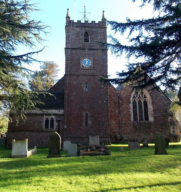 Tower, Church of St Andrews, Alvington. Viewed from Knapp Lane. The church has 12th century origins, though almost all of the present-day church dates from major restorations in the 19th century. The tower is on the west side of the church, which is aligned west to east.