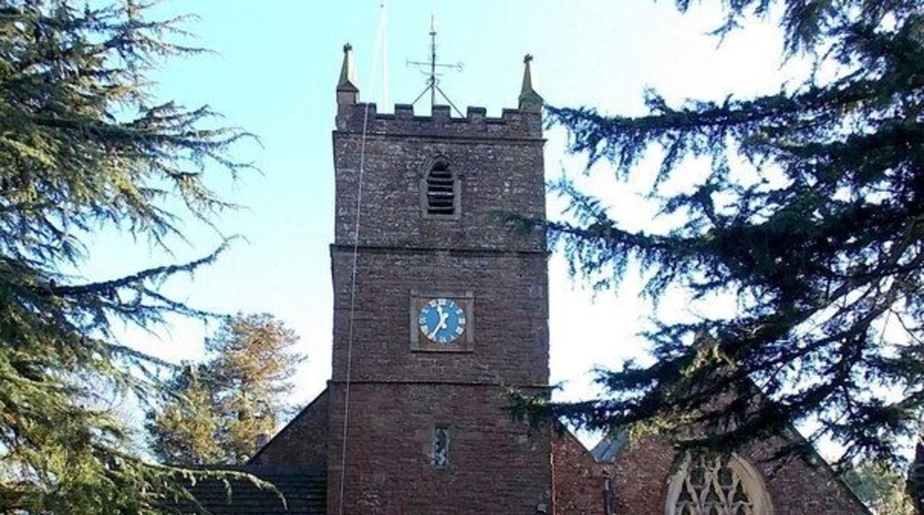 Tower, Church of St Andrews, Alvington. Viewed from Knapp Lane. The church has 12th century origins, though almost all of the present-day church dates from major restorations in the 19th century. The tower is on the west side of the church, which is aligned west to east.