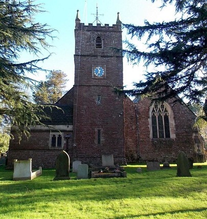 Tower, Church of St Andrews, Alvington. Viewed from Knapp Lane. The church has 12th century origins, though almost all of the present-day church dates from major restorations in the 19th century. The tower is on the west side of the church, which is aligned west to east.