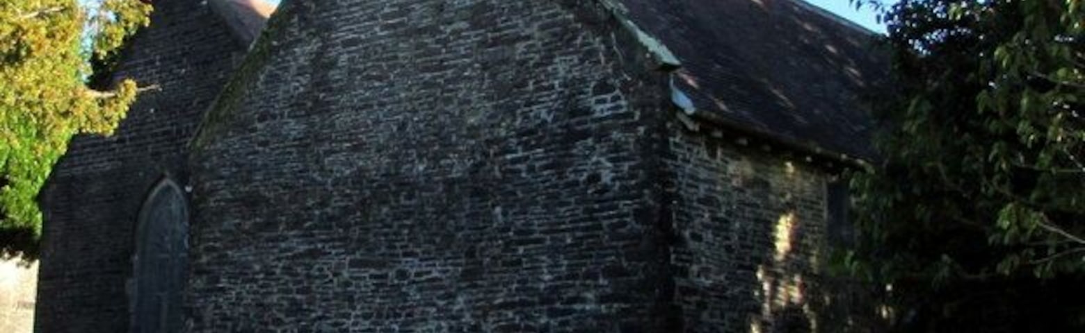 Bellcote and weathervane, St David's Church, Bettws. Cadw records that this exceptional square bellcote at the west end of the nave stands on a shallow stone base supported on the west side by corbels, with square headed openings north, east and south and stone louvres on the west side. Gargoyles are on each upper corner and a corbelled base to a pyramidal roof, surmounted by a fish weathervane. The bellcote reputedly houses two bells of 1891.