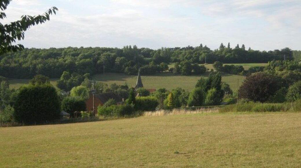 View of Newnham from South. This pretty little village is in a valley on the Faversham Road. Seen from the footpath near Wineycock Lane. Compare with 1431797.
