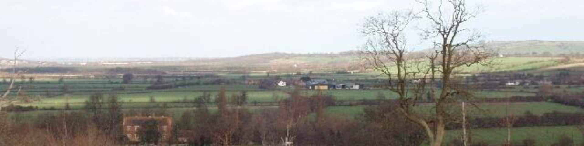 Beckley Park The plum-coloured brick house on the left of the photograph is Beckley Park, built about 1540. The estate belonged to King Alfred in the 9th century. View from the Oxfordshire Way footpath.
