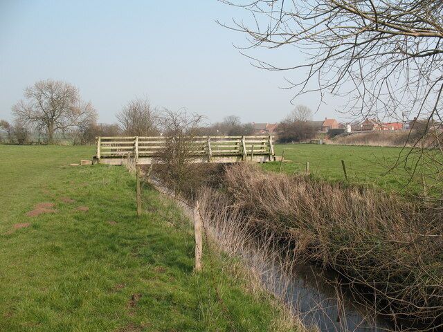 Footbridge over Brompton Beck Timber beam bridge over the beck just to the west of Brompton village.