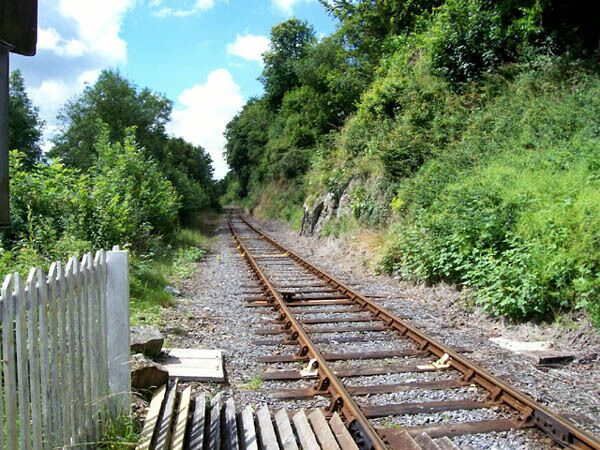 Railway to Llanelli View of railway from the A483 crossing by the station.
