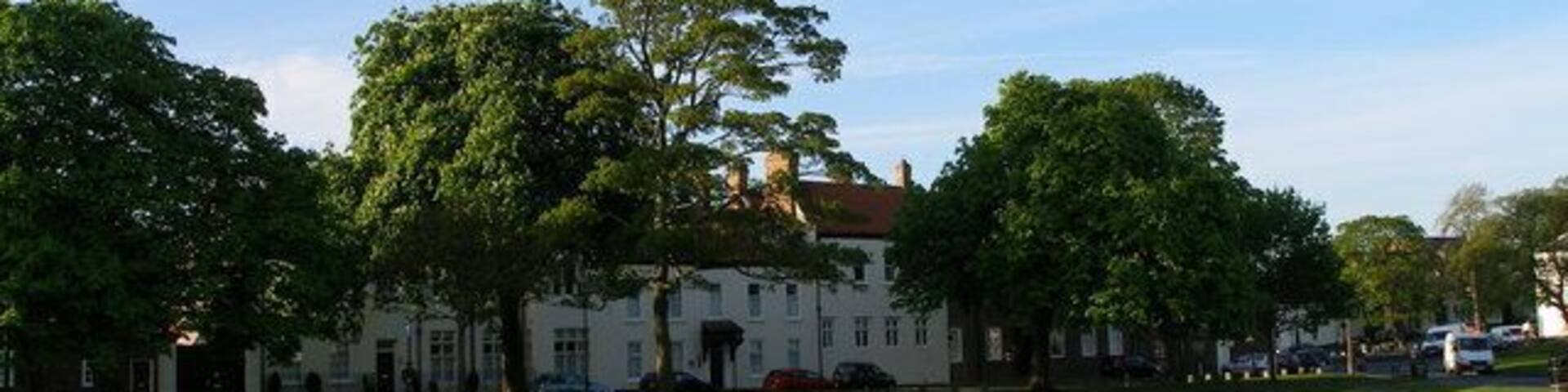 Norton Hall from across Norton Green Norton Hall is now converted into wonderful apartments- imagine having the ballroom as part of your flat! Before this the building was used by ICI to wine and dine guests.