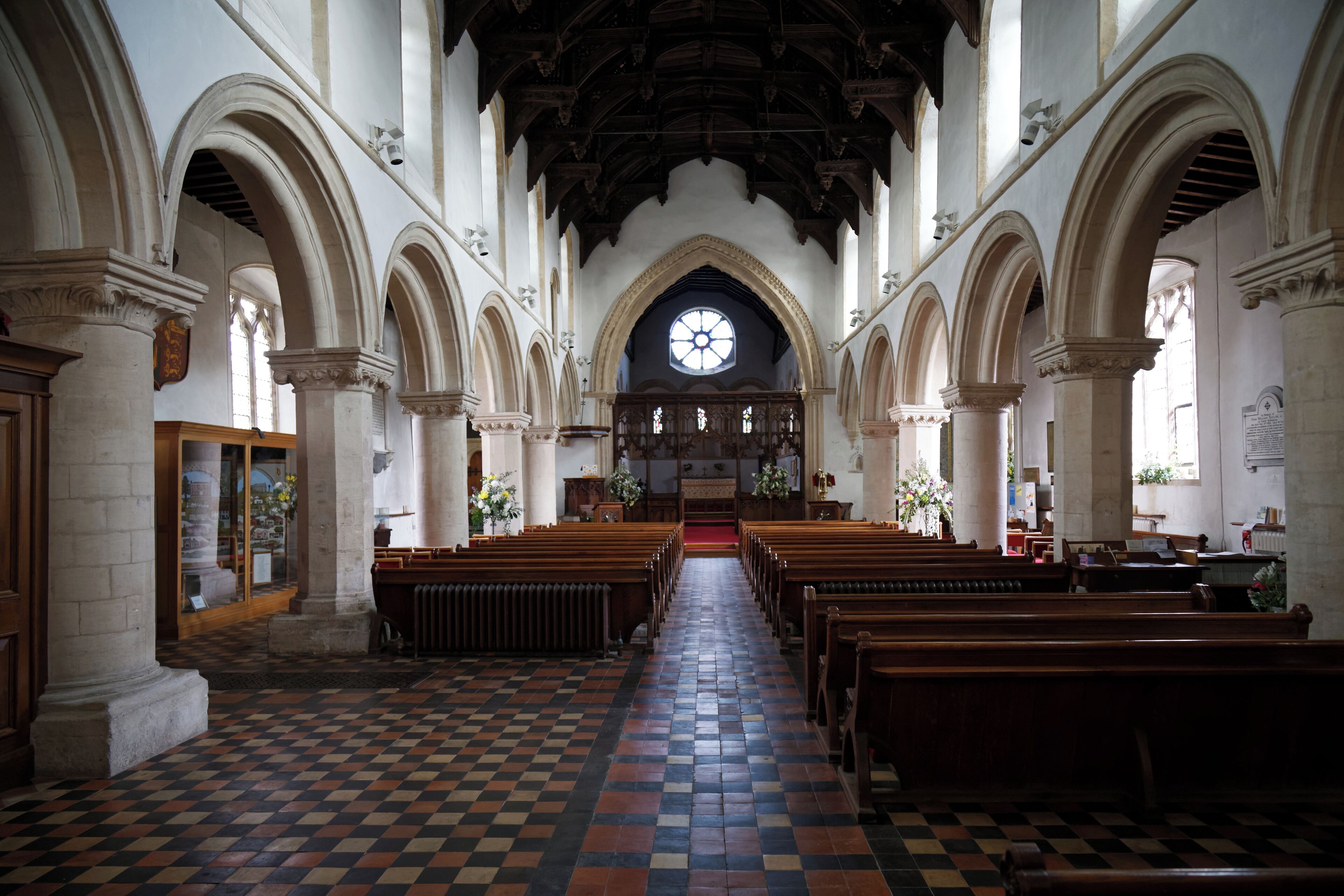 Looking east from the tower along the nave to the chancel of St Nicholas' Church in Castle Hedingham in Essex, England. Second of two shots, this with church interior lights turned off. Camera: Canon EOS 6D with Canon EF 24-105mm F4L IS USM lens. Software: large RAW file lens-corrected, optimized and downsized with DxO OpticsPro 10 Elite, Viewpoint 2, and Adobe Photoshop CS2.