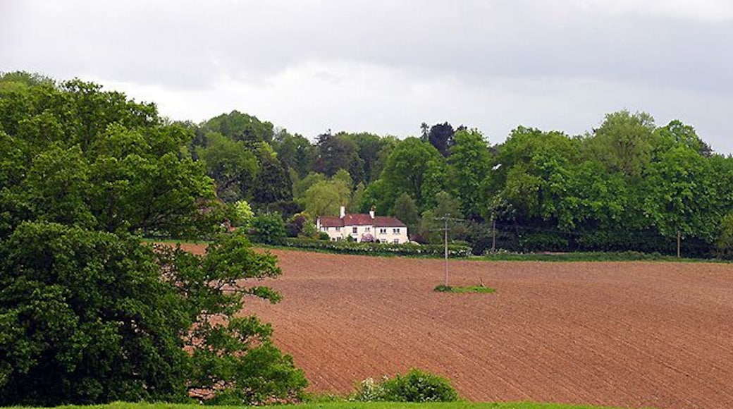 Farmland and Frilsham. This photograph looks across the south eastern section of the grid square incorporating farmland, woodland and residences, typical of this grid square.