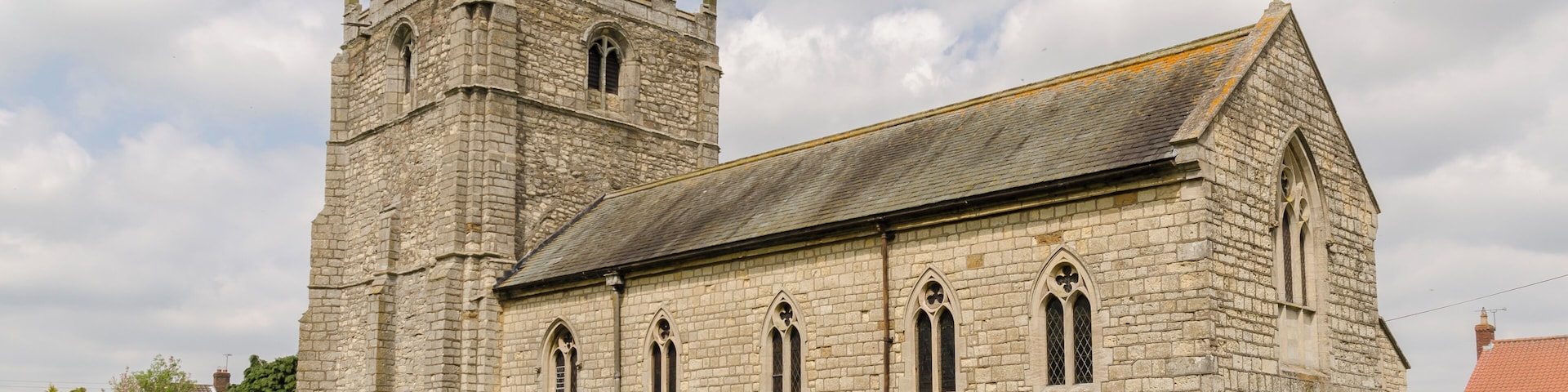 The church dates from the 12th century onwards and was restored by Fowler in the late 19th century. There is a large west tower, nave and chancel in one, and north vestry. The church is entered by the west doorway of the tower which dates from the late 12th century. The tower is of three stages with six large buttresses. It is some 16'3" square internally. Large size is an indication that the population at the time was greater. There is a large arch into the nave. The tower was enlarged in the late 14th century and there are battlements with pinnacles and gargoyles. There are three bells. By the late 18th-century the church was too big for the inhabitants of the parish and was in very poor condition. It was therefore rebuilt, except for the tower. In 1870 the nave and chancel were converted into one by James Fowler. The north vestry was added. Therefore the majority of the church except for the tower is from the 19th century, including the font. The reredos is by A. B. Skipworth and Conrad Dressler. The organ was originally built by Benjamin Flight and was purchased in 1935 from the Wesleyan Chapel in Kirton in Lindsey. It has recently been restored.