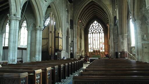 The church dates from circa 1300 onwards. It was restored in 1867 and 1887. It is one of the finest 14th century churches in England. Built between 1305 and 1333, it replaced an earlier church which was recorded in the Domesday book. The church was probably begun by Lora de Gant, Lady of the Manor of Heckington. Its greatest glories are due to the generosity of two men linked with King Edward II, Lord Henry de Beaumont and master Richard de Potesgrave. Beaumont's coat of arms once appeared in many of the stained-glass windows. Richard de Potesgrave (circa 1275 to 1349) was rector of Heckington in 1309 and was the Kings' chaplain. In 1321 he was given custody of Leeds Castle in Kent. The church consists of a west tower with spire, clerestoried nave, north and south aisles, transepts, chancel, south porch and north Chapel The three stage tower and spire is 185 feet high with three tiers of lucarnes. There are multiple gargoyles on gabled niches as well as on crocketted pinnacles. The south porch dates from the decorated period although suffered from vandalism to statues in niches. Over the entrance is a statue of Christ in Glory. Inside, there are four bay north and south nave arcades with octagonal piers. There was originally a Rood screen separating the nave and the chancel. The north aisle is probably the oldest part of the church and the north transept was formerly used as a Chantry Chapel, the piscina is still in position. The south transept, has its own sedilia, and in the south-west corner there is a burial slab with an engraved bust, possibly Potesgrave's father from the 14th century. The south transept was probably the "Chantry of Saint Nicolas" where rector Potesgrave's parents were prayed for. The chancel was built by Potesgrave whose tomb is recessed into the north wall with a damaged effigy. He died in 1349 aged about 75, possibly of the Black Death. When the tomb was opened in 1800 his communion chalice was found inside. The east window is 34 foot high and 16 feet wide with seven lights. On the north wall of the chancel is an Easter Sepulchre, complete with sleeping soldiers beneath crocketted gables. To either side are figures, and above is the risen Christ attended by censing Angels. The Sepulchre was also used as a permanent sacrament shrine, where consecrated bread and wine were kept. There is also a double piscina in the chancel and an elaborate triple sedilia with fine decorative carvings depicting Saint Margaret with her Dragon, the coronation of the Virgin Mary and Christ, Saint Catherine with her wheel, and other Angels. Pic by Jenny.