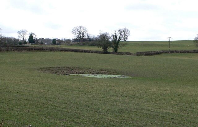 Dewpond? Possibly a dewpond near Nantclwyd Uchaf, Graigadwywynt. An artificial pond for feeding livestock.