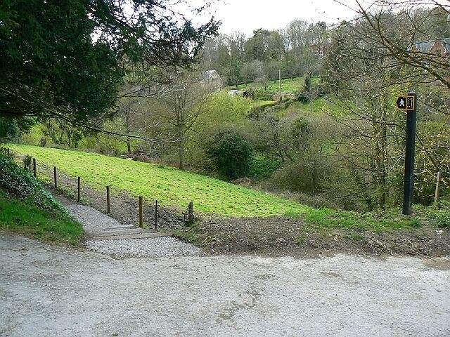 Footpath by St James the Great church, Bratton The footpath skirts the northern boundary of the churchyard before turning south.