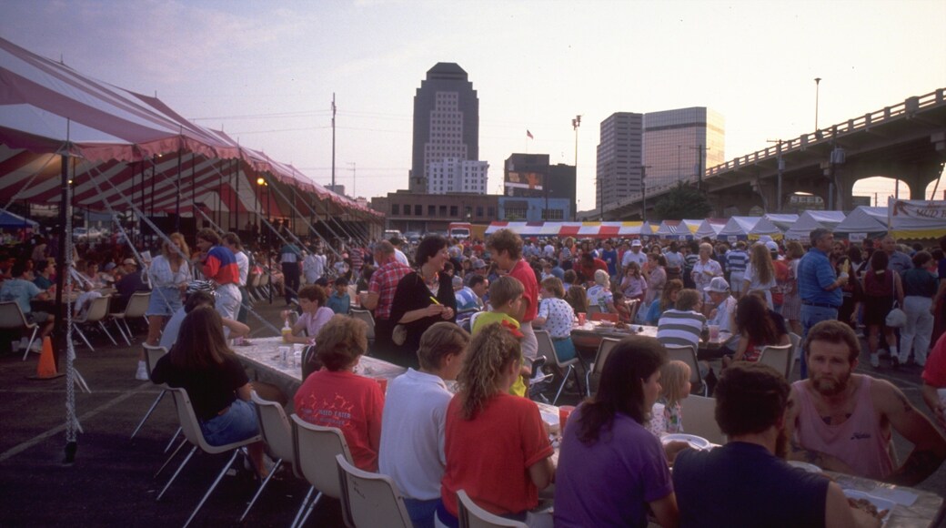 Shreveport Festival Plaza featuring a sunset and outdoor eating as well as a large group of people