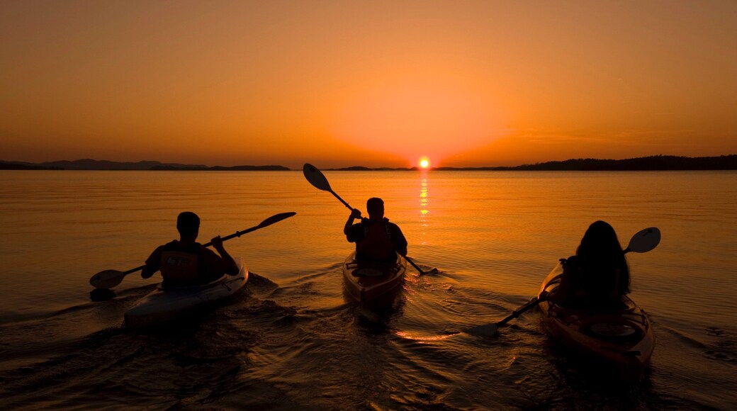 Lake Ouachita State Park featuring kayaking or canoeing, a sunset and general coastal views