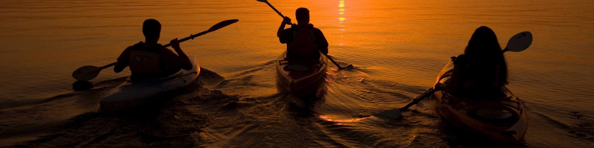 Lake Ouachita State Park featuring kayaking or canoeing, a sunset and general coastal views