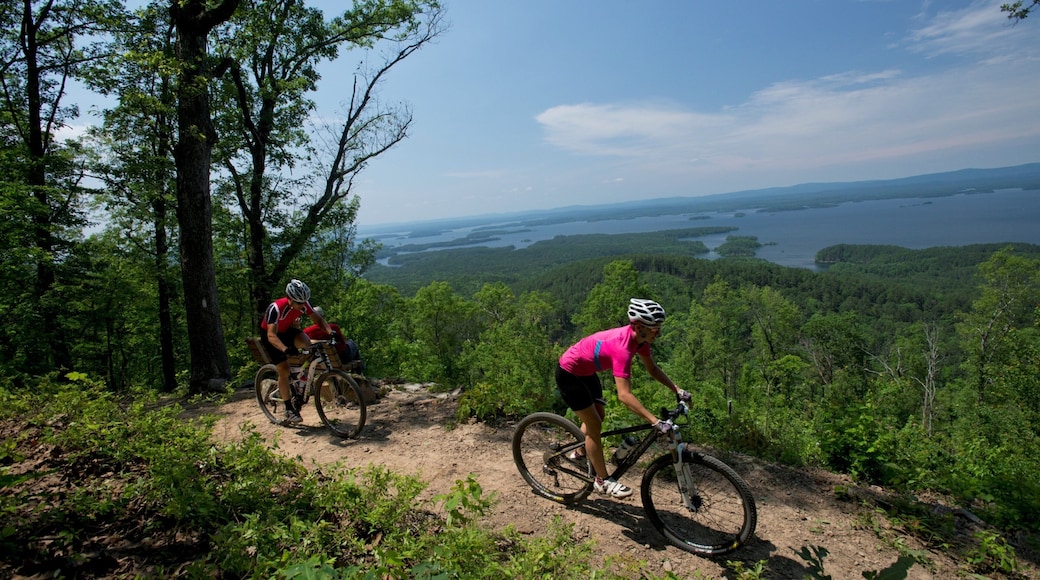 Lake Ouachita State Park showing tranquil scenes and mountain biking as well as a couple