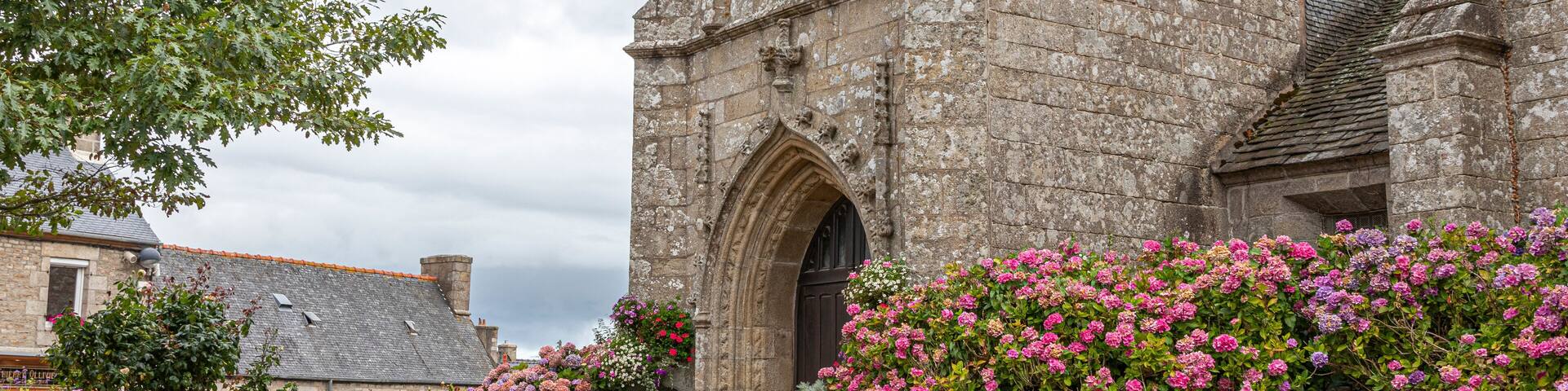 Ploumilliau (Plouilio), France. The Eglise Saint-Milliau (St Miliau Church), a Roman Catholic Gothic temple in this small town of Brittany