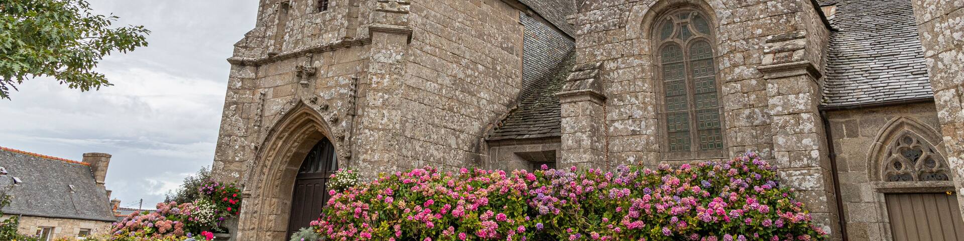 Ploumilliau (Plouilio), France. The Eglise Saint-Milliau (St Miliau Church), a Roman Catholic Gothic temple in this small town of Brittany