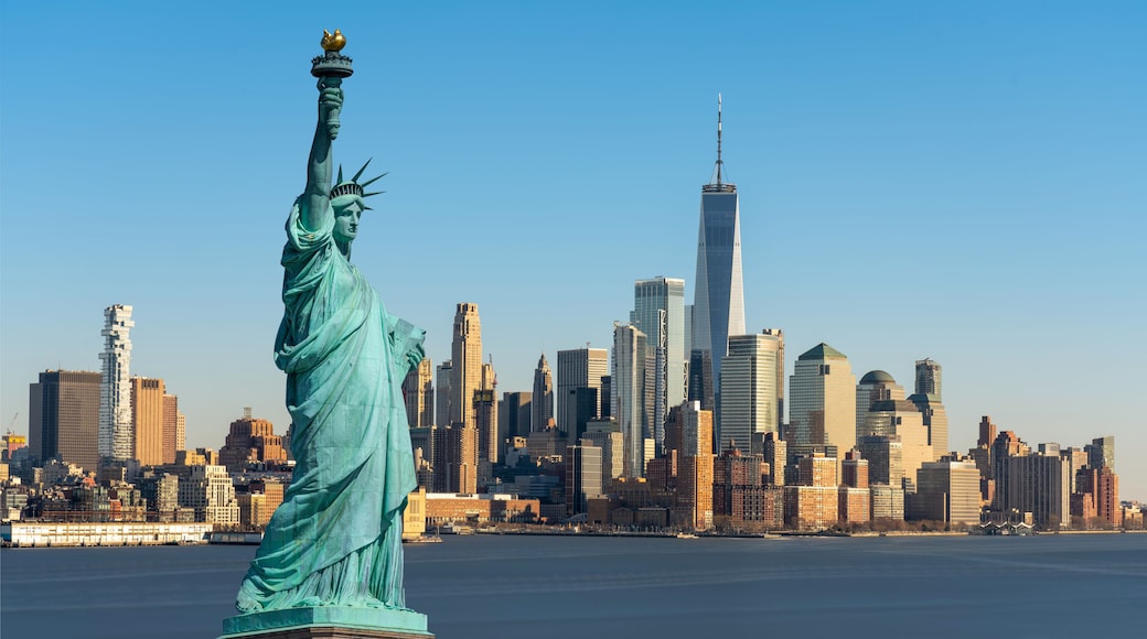The Statue of Liberty over Scene of New York cityscape river side which location is lower manhattan which can see One world trade conter, United state of America, USA, Taking from New Jersey skyline