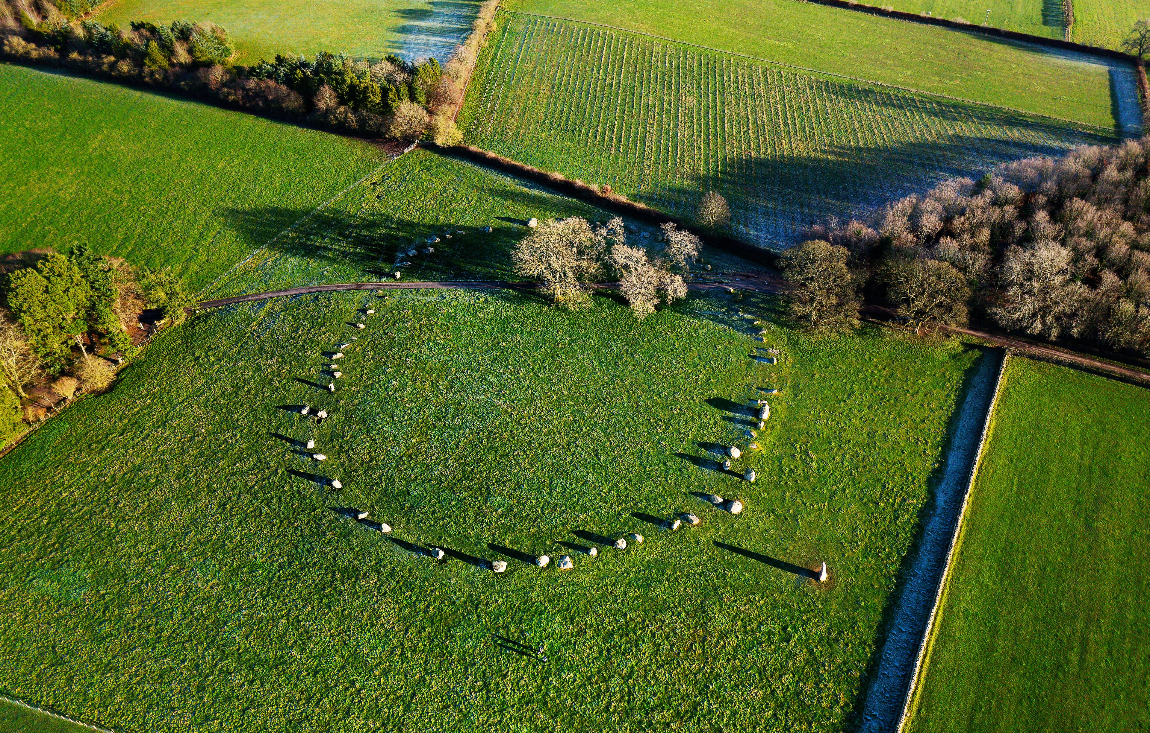 Long Meg and Her Daughters. Prehistoric Neolithic stone circle. Langwathby, Cumbria, UK. Aerial of circle and outlier stone with winter hoar frost