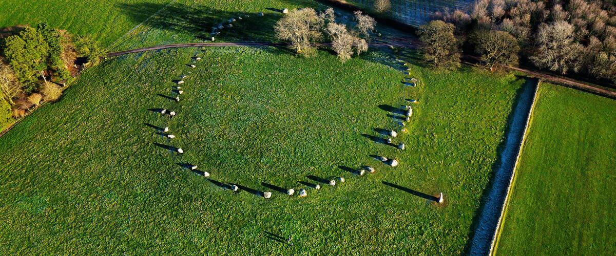 Long Meg and Her Daughters. Prehistoric Neolithic stone circle. Langwathby, Cumbria, UK. Aerial of circle and outlier stone with winter hoar frost