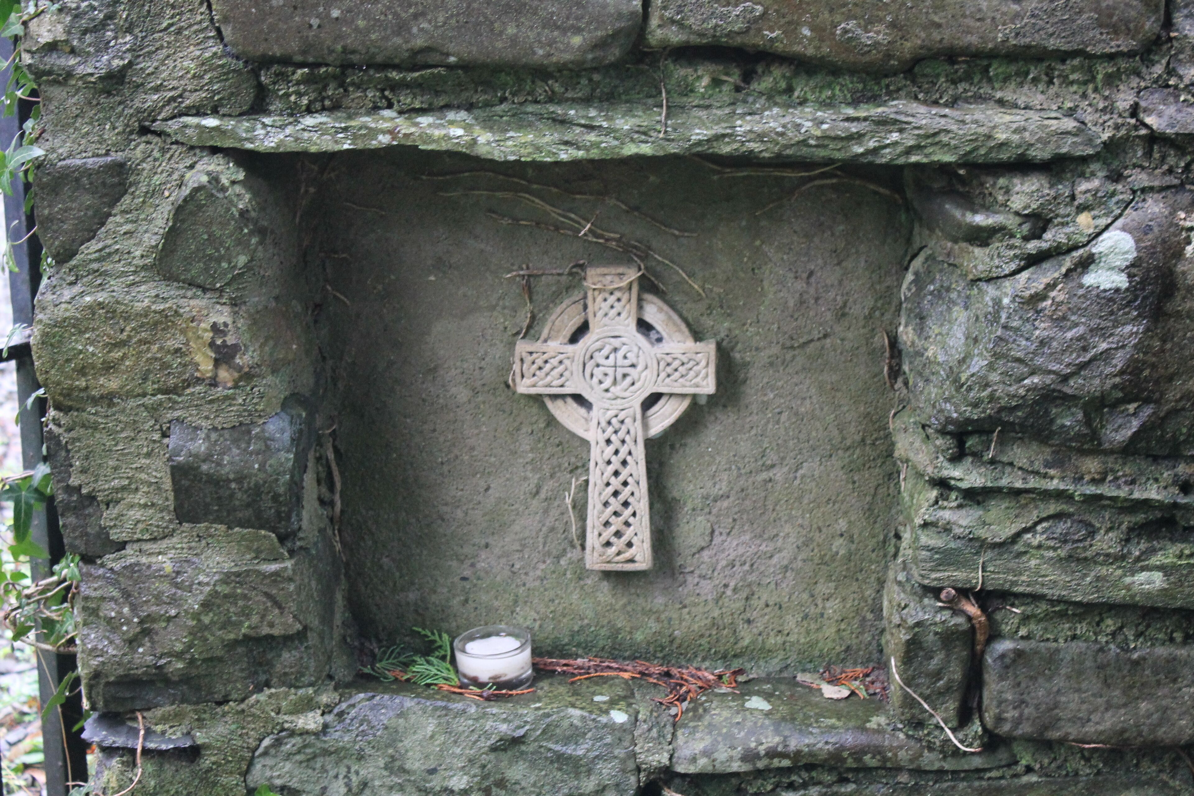 The church of Llanina, near Ceinewydd (New Quay), Ceredigion. Celtic cross in wall, near the entrance.