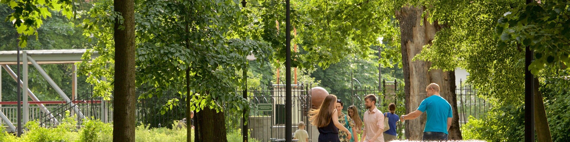 Vilnius which includes a fountain and a park as well as a small group of people