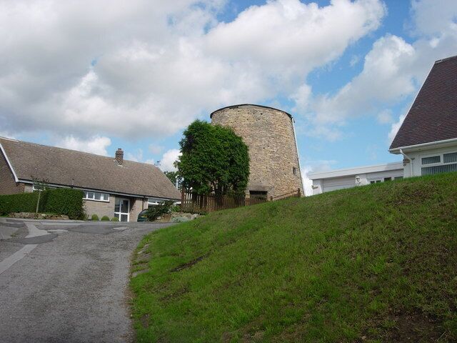 Upton tower mill, West Yorkshire Stump of a tower mill near the water tower on Beacon Hill in the grounds of "Adastra" house.