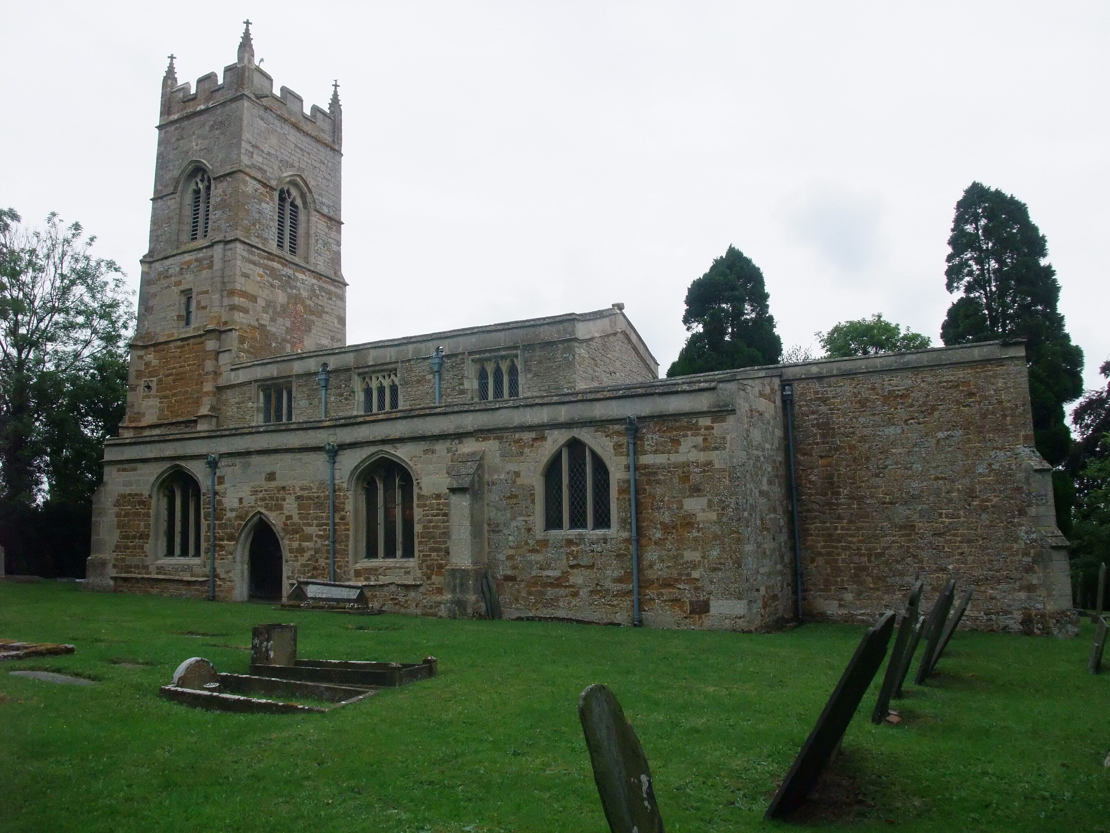 A historic church with a tall tower and arched windows.