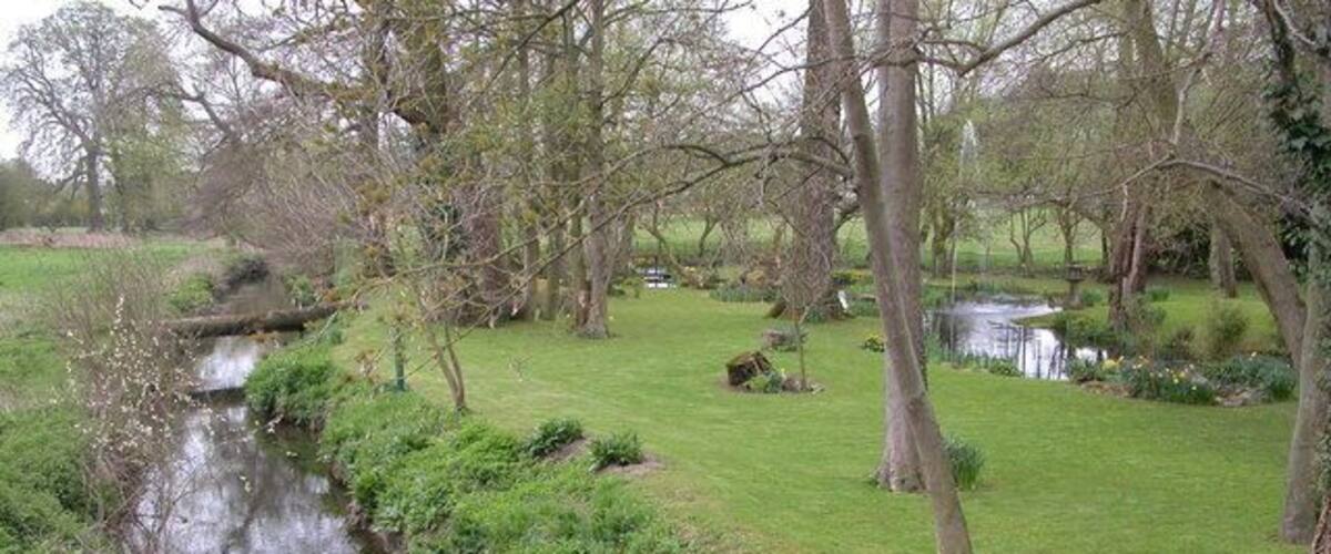 The River Kemp, Kempton. The river Kemp and attractive water garden viewed from the Shropshire Way as it crosses a bridge near Kempton.
