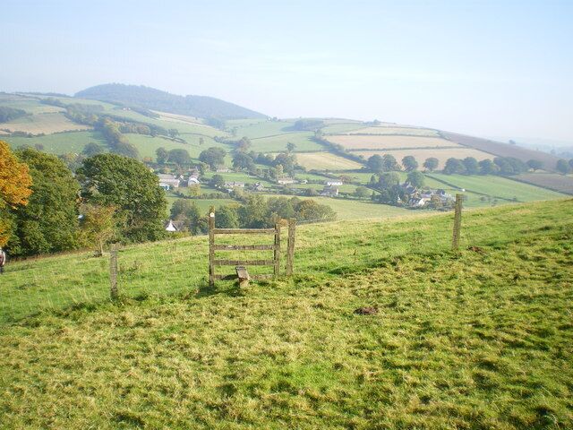 Kempton and Burrow hillfort from Clunton Hill Eastwards from the footpath up Clunton Hill, over the Kemp valley, to the hillfort on Burrow. It was a particularly hazy day.